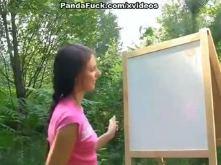 Alluring strap on fuck with young artist outdoor