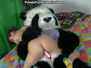 Desirable brunette schoolgirl seducing Panda bear